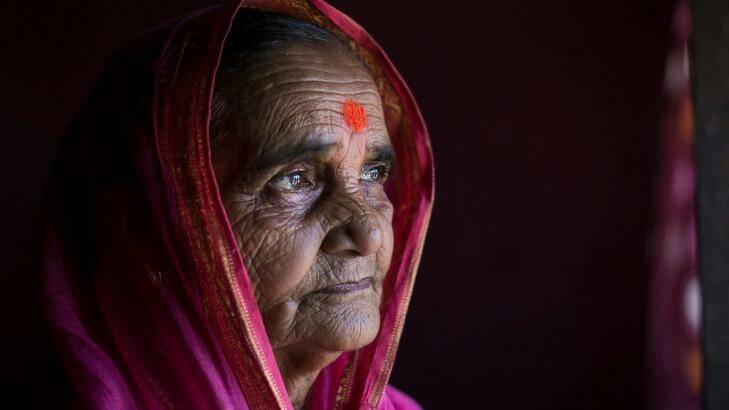 80-year-old Ramabai Ganpat Khandakle is one of 30 elderly women who are going to school for the first time in their life in the Thane district, India.  Photo: Allison Joyce/Newslions