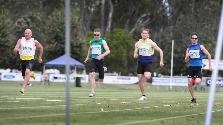 Hignett, left, leads the field in the dash to the line at JC Lowe Oval on Saturday.