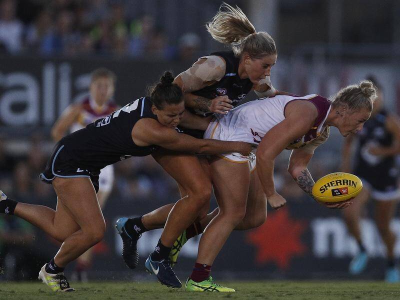 The Brisbane Lions say the departure of Tayla Harris (C) to Carlton's AFLW squad is a blessing.