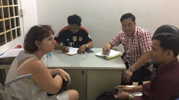 Tammy Davis-Charles being questioned by Cambodian police. Photo: Cambodian National Police