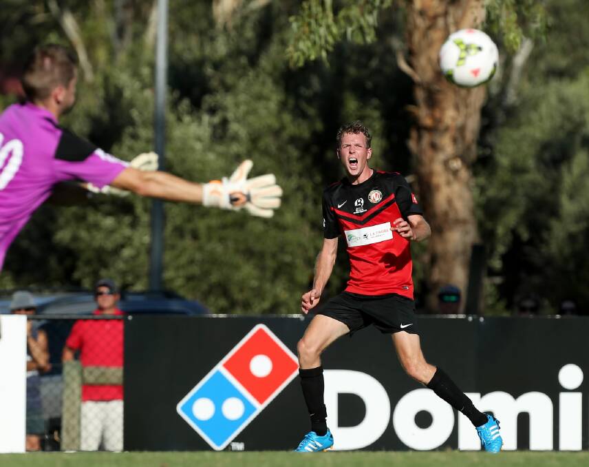 Adam Waters fires in a cross in the opening round of the NPL1 against Box Hill United. Picture: MATTHEW SMITHWICK