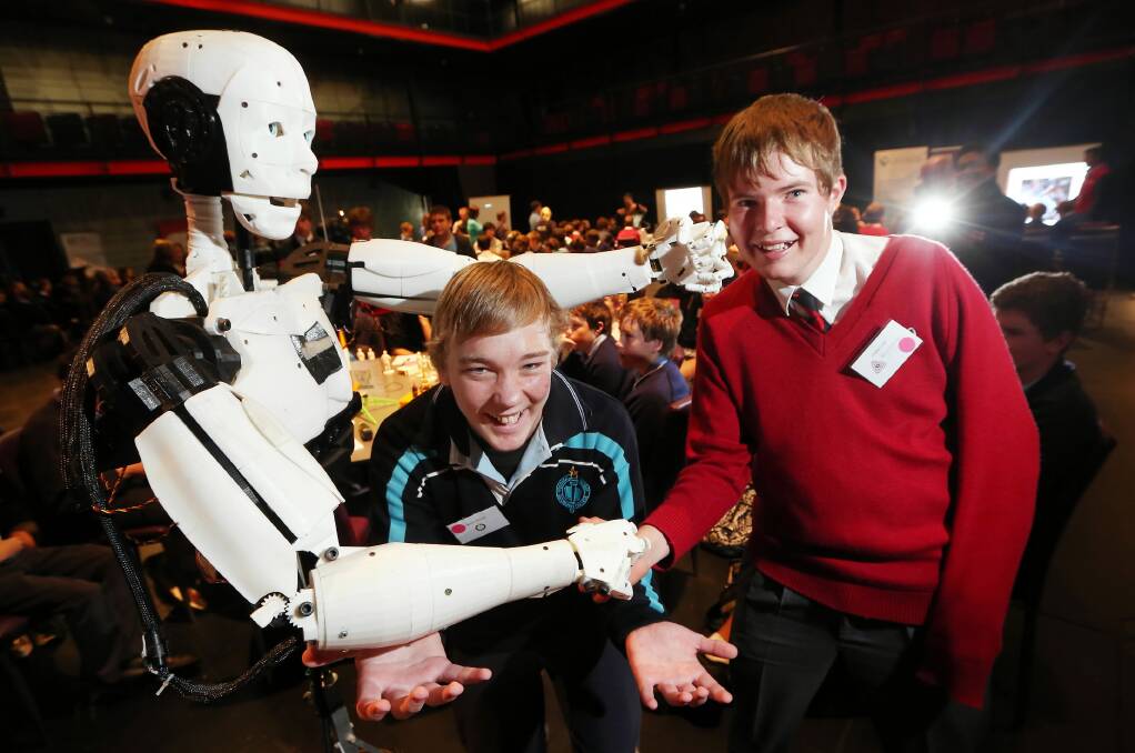 Wodonga Senior Secondary College student Lachlan Murdoch and Trinity Anglican College student Charles Luke got up close and personal with a 3D printed robot at the forum. Picture: JOHN RUSSELL