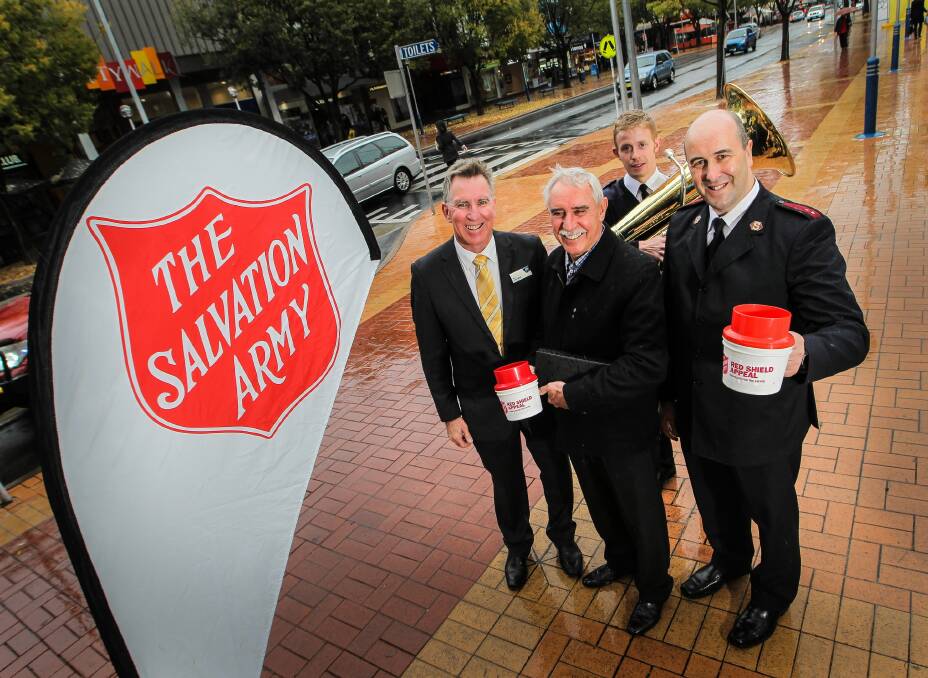 Kevin Mack launches the Red Shield Appeal in Dean Street yesterday with Ian Elston, Salvation Army Band musician Rhys McKee and Salvation Army northern Victoria divisional and fund-raiser secretary Andrew Van Gaalen. Picture: DYLAN ROBINSON