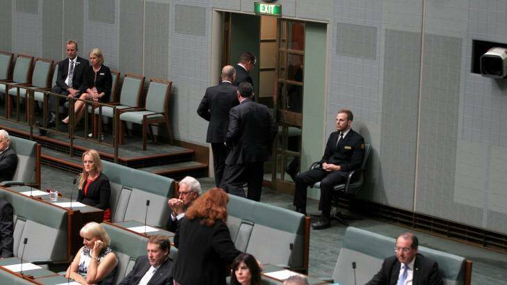 A group of Coalition MPs walk out of the chamber while Opposition Leader Bill Shorten raised the budget in his Closing the Gap speech. Photo: Alex Ellinghausen