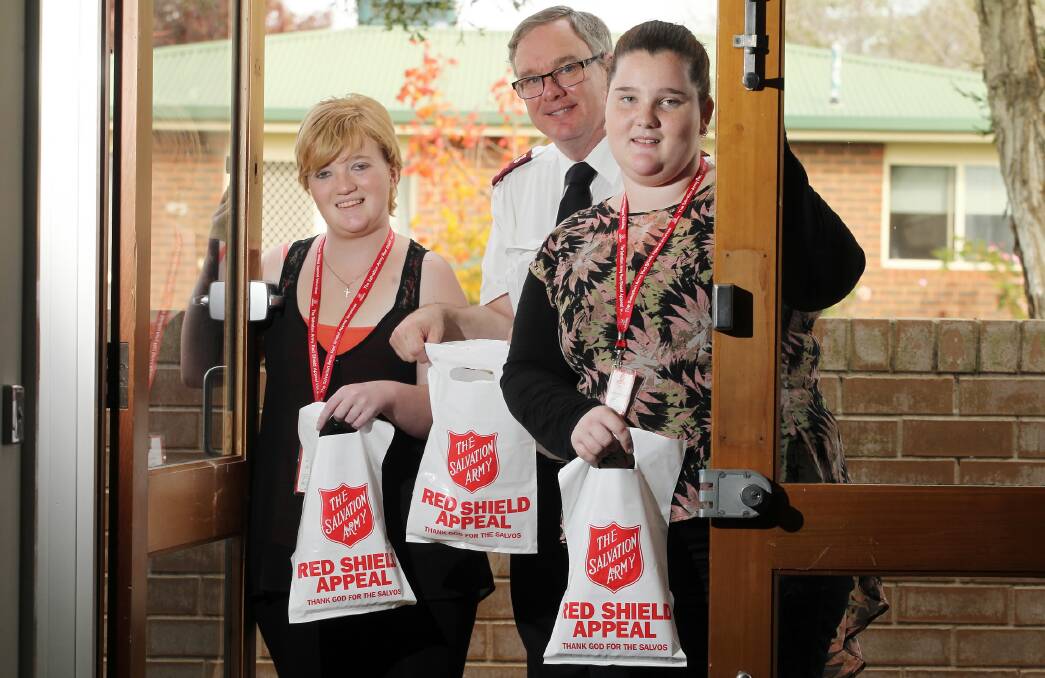 Salvos’ Russell Anderson with Jessica and Jasmine Howell who doorknocked for the Red Shield Appeal. Picture: KYLIE ESLER