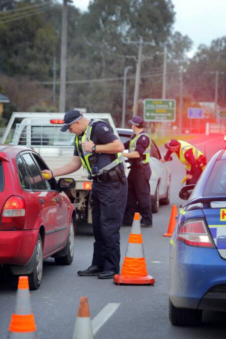 Police conduct number plate checks and breath tests as part of a blitz around Wangaratta yesterday. Picture: TARA GOONAN