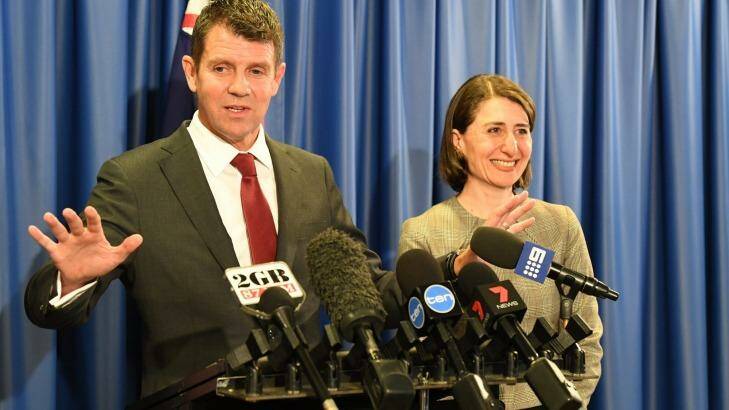 Announcing the deal with NSW Treasurer Gladys Berejiklian,Premier Mike Baird said the winning bid's unique criterion was "the 100 per cent Australian ownership". Photo: Peter Rae