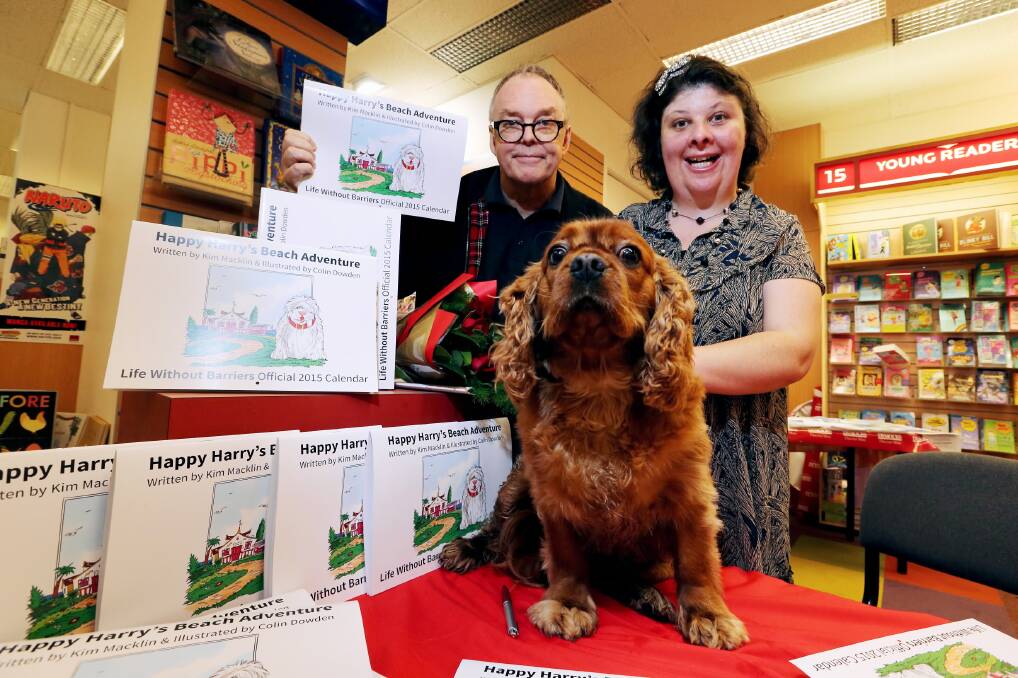 LEFT: King Charles cavalier Millie was a star at the launch of a book illustrated by Colin Dowden and written by Kim Macklin. Picture: JOHN RUSSELL