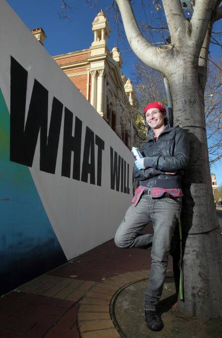 Trina Collins has stencilled the hoarding around the Albury Art Gallery with the help of some high school students from Albury. It will be on display for three months. Picture: KYLIE ESLER