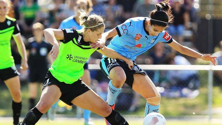 Canberra United defender Ellie Brush (left) challenges Sydney FC's Leena Khamis for the ball in last week's W-League game in Sydney. Photo: Stefan Postles