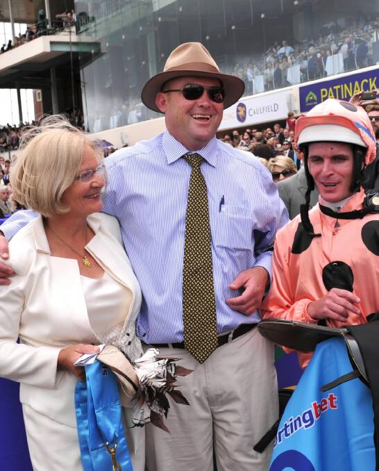 Pam Hawkes, with Peter Moody and Luke Nolen after Black Caviar recorded win number 18 in 2012, is proud of her association with the world’s fastest sprinter — and has the number plates to prove it.