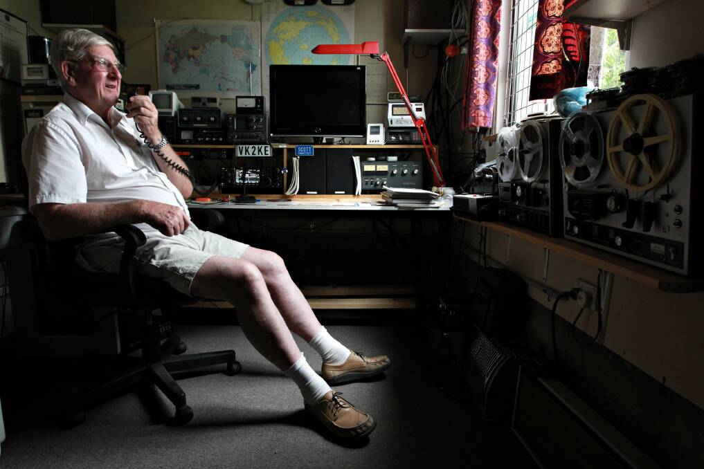 Graeme Scott talks to another amateur radio operator from the radio room in his home. Picture: KYLIE ESLER
