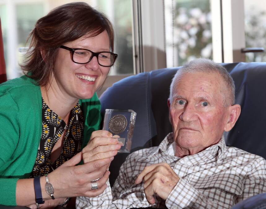 Rebecca Humphreys with John Pitman, 73, who has received the Kellion Victory Medal. Picture: PETER MERKESTEYN