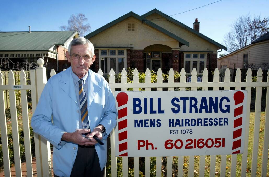 Albury Barber, or tonsorial artist, Bill Strang pictured outside his shop in June 2005.