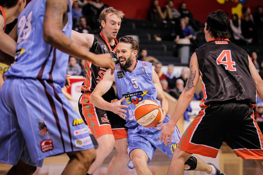 Bandits Nick Payne attempts to push past the Brisbane defender and drive to the basket in last night’s win. Pictures: DYLAN ROBINSON