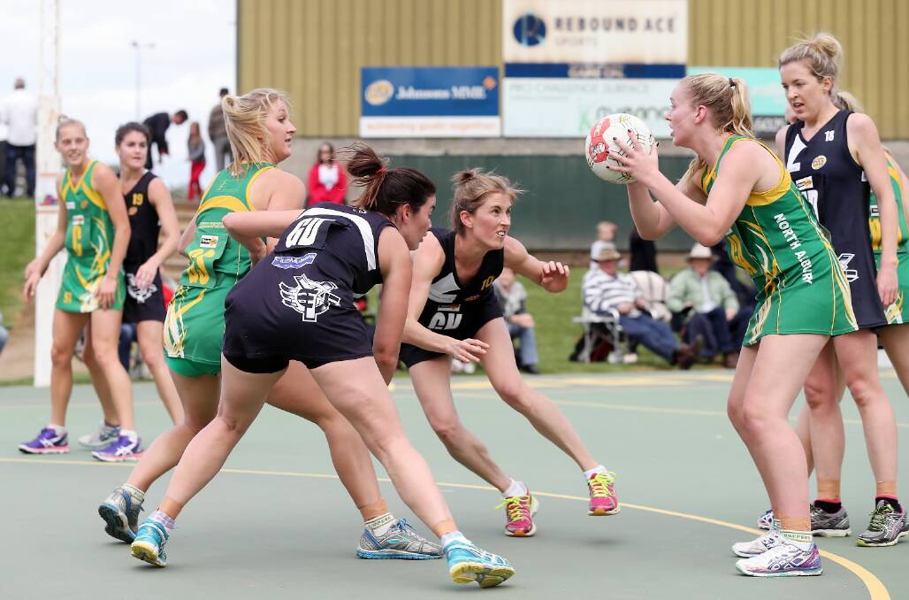 Sophie Robertson, ball in hand, and Jess Fisher-Curnow helped drag the Hoppers back into the contest against Yarrawonga. 