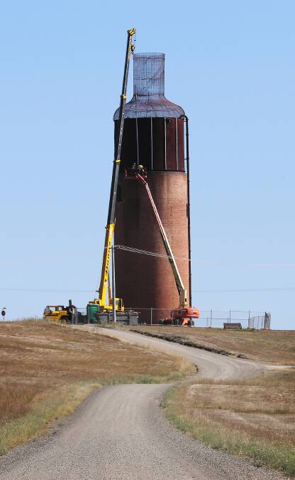 Restoration works on Rutherglen’s old water tower to revive it as a giant wine bottle began last week. Picture: JOHN RUSSELL