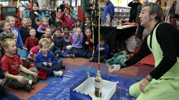 Dr Graham Walker conducts an experiment with mentos and coke at Gungahlin Library. His <i>Little Scientists' Puppet Show</i> was held at the library as part of National Science Week. Photo: Jeffrey Chan