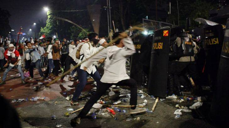 Friday night's clashes with police at the rally protesting against Ahok in Jakarta.   Photo: Roni Bintang