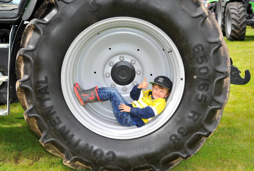 FUTURE: Blake Pound, 4, tries out a new tractor at the 2016 Henty Machinery Field Days. Farmers of young and old will be at the 2017 Field Days opening day, on Tuesday. Picture: Kieren L Tilly 
