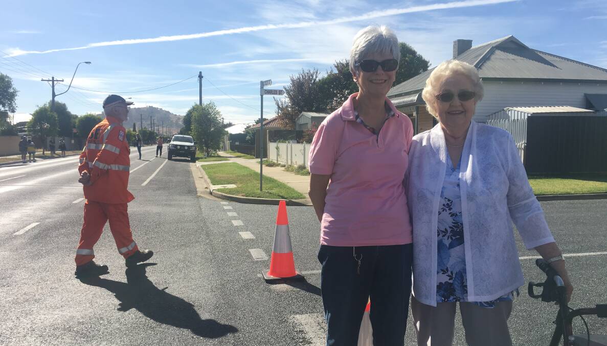 Mary Harkness and Wilma Cunnington waiting along the baton route.
