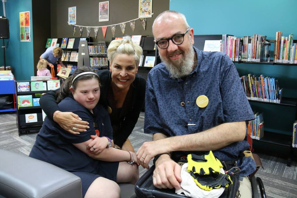 LIFE CHANGING: Mayor Anna Speedie with Cassie Allen, who undertook a work placement at Wodonga Library and her father Roderick Allen who volunteers weekly in the library. Picture: SUPPLIED 
