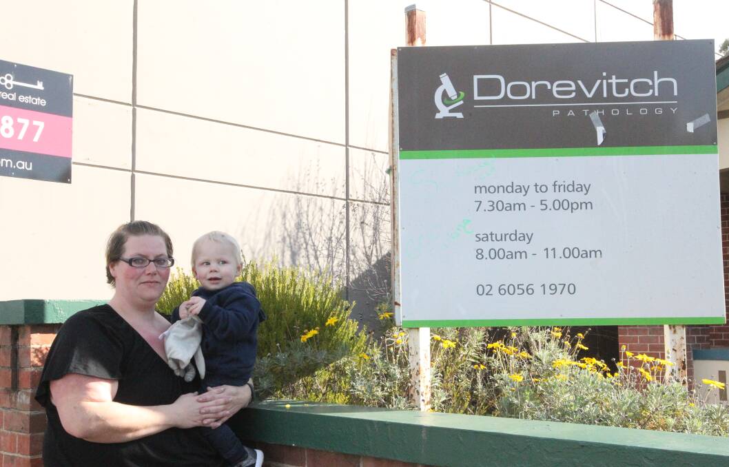 STRIKE HURTS: Melissa McDonald and Kayden, 19 months. Miss McDonald, a single mother, said the Dorevitch industrial action was necessary despite the financial and emotional toll of being indefinitely without an income.