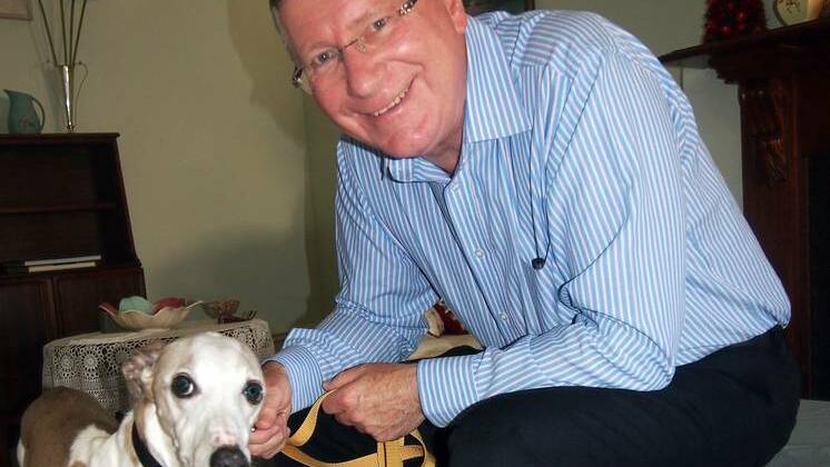 Victorian Premier Denis Napthine gets acquainted with his new whippet Liam.