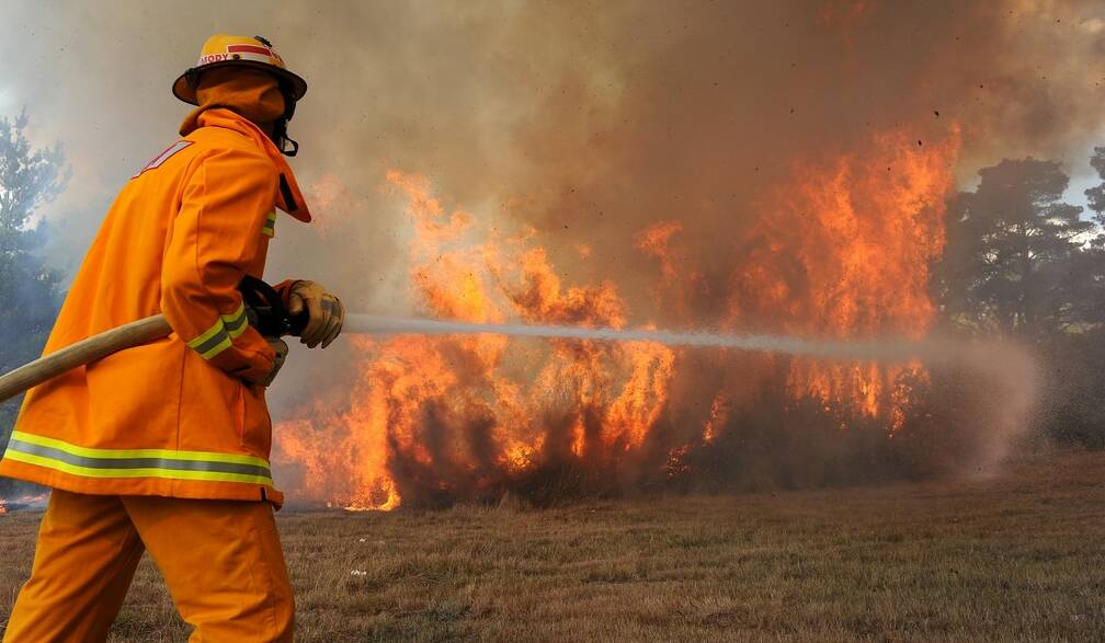 Leading Firefighter John Carmody at the bushland on Saturday. Picture: Justin Whitelock.