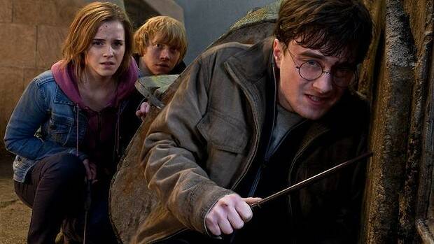 Danielle Radcliffe (right) as the boy wizard, with Emma Watson and Rupert Grint, in Harry Potter and the Deathly Hallows: Part 2.