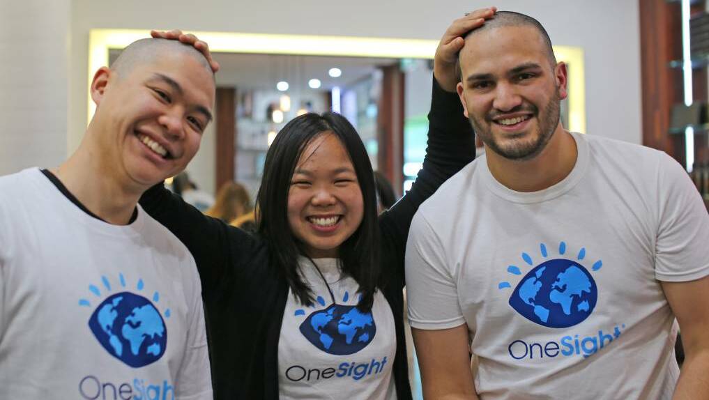 Dubbo optometrist Carina Ng (centre) with Kelvin Chan and Nathan Shooter at a 'Shave for Sight' fundraiser earlier this month. Photo: THRIVE MEDIA