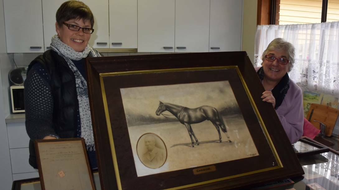 Australian Racing Museum collections manager Alison Raaymakers and Port Campbell's Margaret Johnston with some of the Carbine collection.