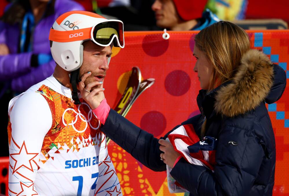 Morgan Miller (R) comforts her husband Bode Miller of the United States during the Alpine Skiing Men's Super-G on day 9 of the Sochi 2014 Winter Olympics at Rosa Khutor Alpine Center on February 16, 2014 in Sochi, Russia. Photo: GETTY IMAGES
