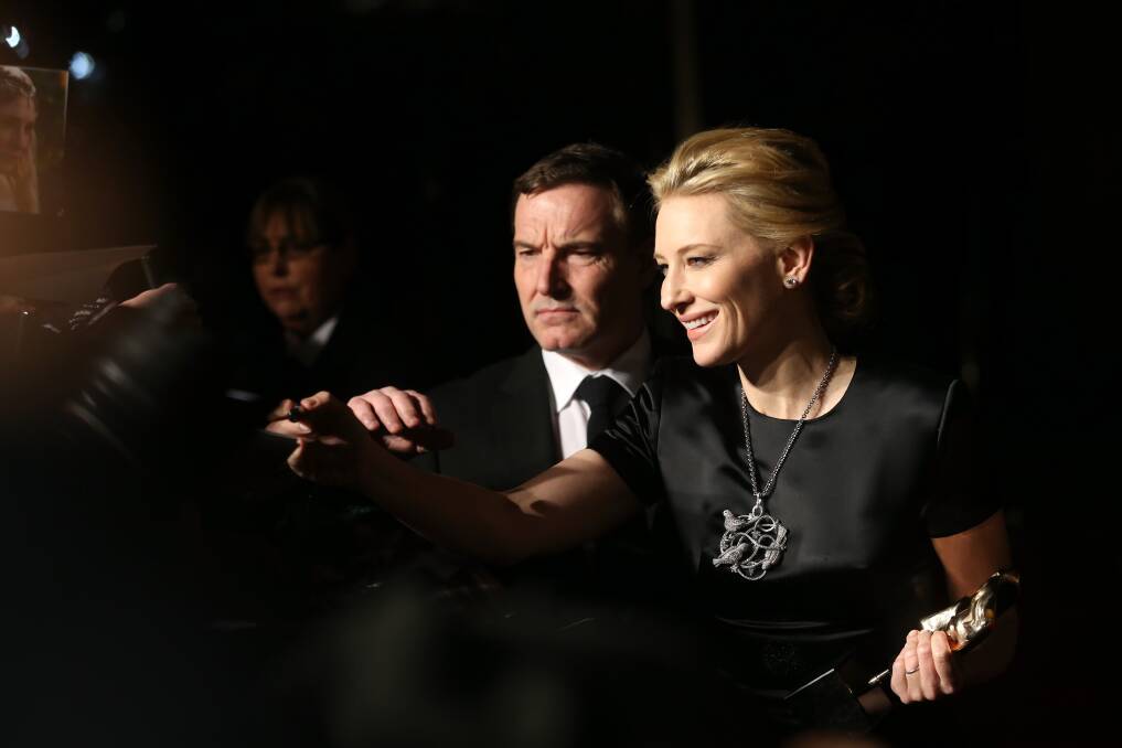 Cate Blanchett signs autographs as she attends an official dinner party after the EE British Academy Film Awards Photo: GETTY IMAGES