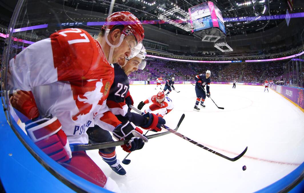 Kevin Shattenkirk #22 of United States handles the puck against Alexei Tereshchenko #27 of Russia in the first period during the Men's Ice Hockey Preliminary Round Group A game on day eight of the Sochi 2014 Winter Olympics at Bolshoy Ice Dome on February 15, 2014 in Sochi, Russia. Photo: GETTY IMAGES