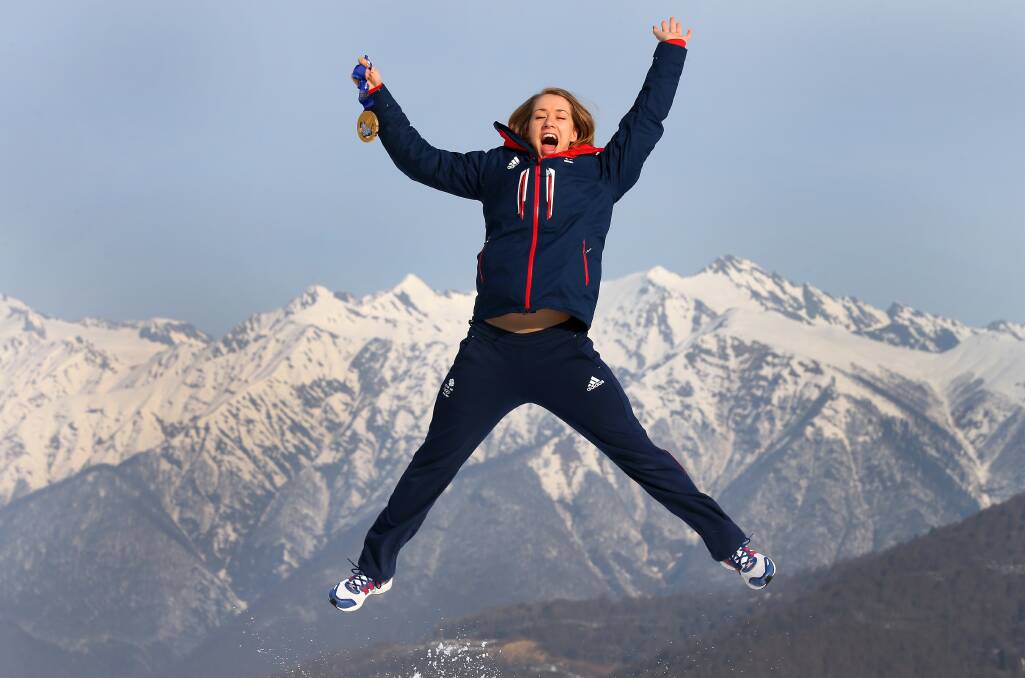 Lizzy Yarnold of Great Britain jumps holding her gold medal after winning the Women's Skelton as she poses for a portrait at the Rosa Khutor mountain village on day 9 of the Sochi 2014 Winter Olympics on February 16, 2014 in Sochi, Russia. Photo: GETTY IMAGES