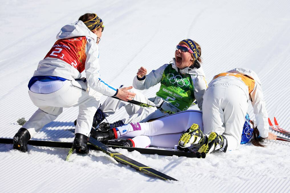 (L to R) Ida Ingemarsdotter, Emma Wiken, Anna Haag and Charlotte Kalla of Sweden celebrate winning the gold medal in the Women's 4 x 5 km Relay during day eight of the Sochi 2014 Winter Olympics at Laura Cross-country Ski & Biathlon Center on February 15, 2014 in Sochi, Russia. Photo: GETTY IMAGES