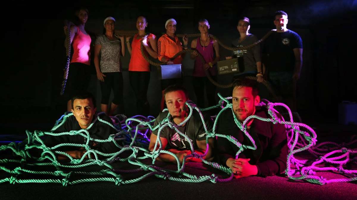 Night Attack, a night time obstacle course, is coming to Hunter Stadium. At rear from left, Carmen Retzlaft, Renae Weinert, Olivia Meek, Michelle Lennon, Dandy Barwick, Trisha Kelly and Brendan McInerney. FRONT: Richard Henwood, McLean Nadfalusi and Heath Poper from NXFM. Photo by Marina Neil 