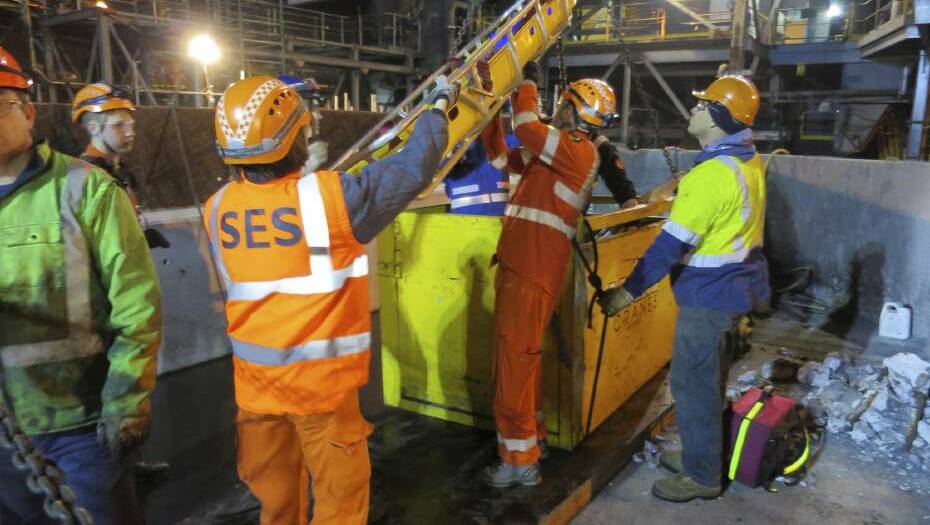 SES and emergency services work to pull a BlueScope contractor from a pit following an accident at the steel giant’s coke making plant. Picture: SES - WOLLONGONG CITY UNIT 