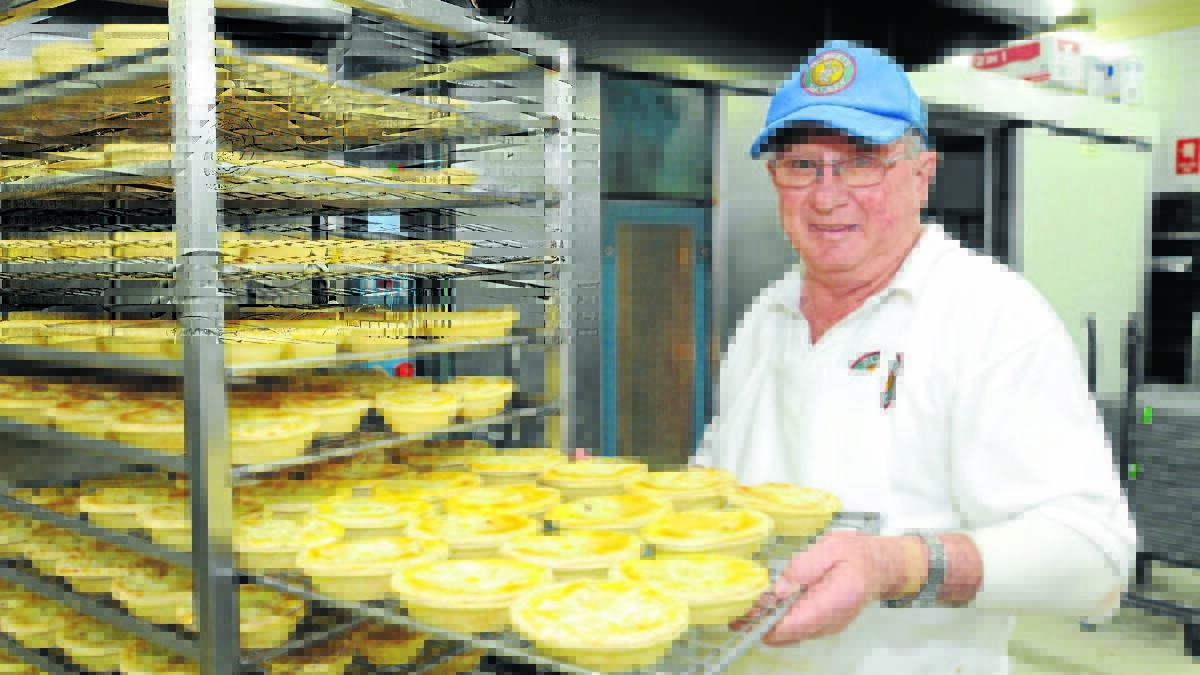 LAST BATCH: Bob Hamilton hung up his baker’s hat for the last time yesterday, retiring from his job at Roberts Bakery after 49 years in the business. Photo: STEVE GOSCH 
