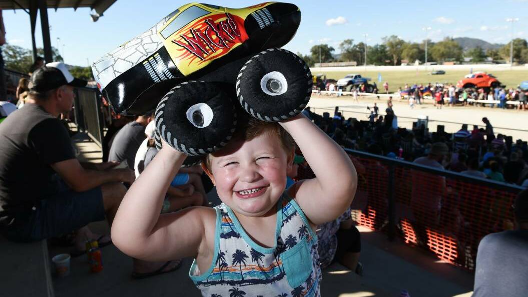 BIGGEST FAN: Mason Smith-Moore, 2, of Wodonga, who is a big-truck fan, gets in on the action at the Monster Trucks show at the Albury Showgrounds on Saturday night. Pictures: MARK JESSER