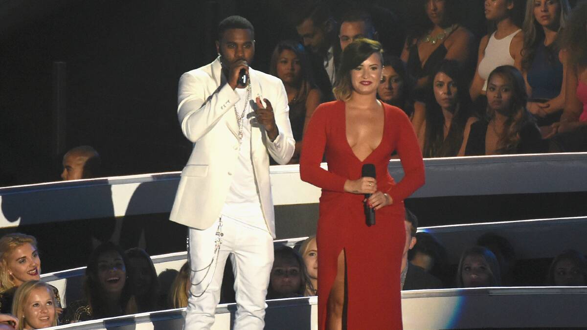 Recording artists Jason Derulo (L) and Demi Lovato onstage during the 2014 MTV Video Music Awards. PHOTO: Getty Images