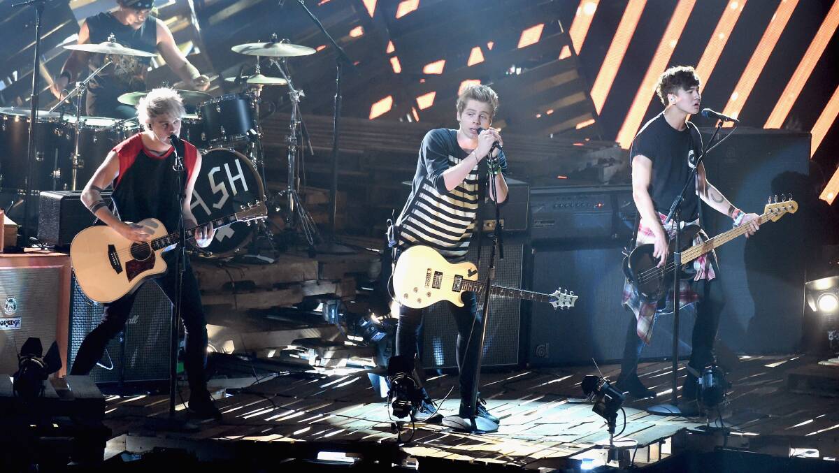 Recording artists 5 Seconds of Summer perform onstage during the 2014 MTV Video Music Awards. PHOTO: Getty Images