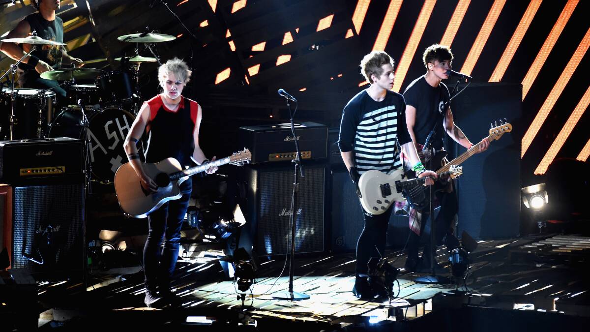 Recording artists 5 Seconds of Summer perform onstage during the 2014 MTV Video Music Awards. PHOTO: Getty Images