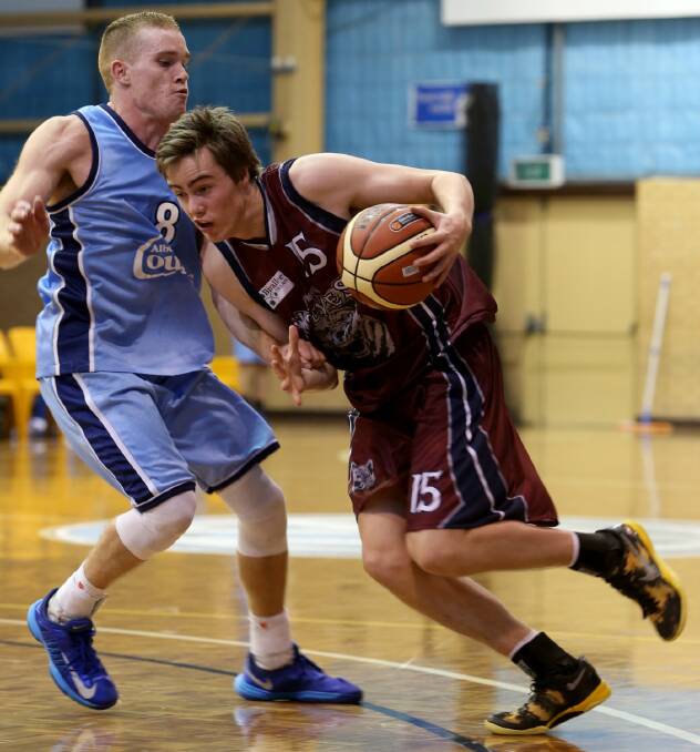Trent McMullan in action for the Wodonga Wolves, takes on Albury Cougars star Jack Duck.