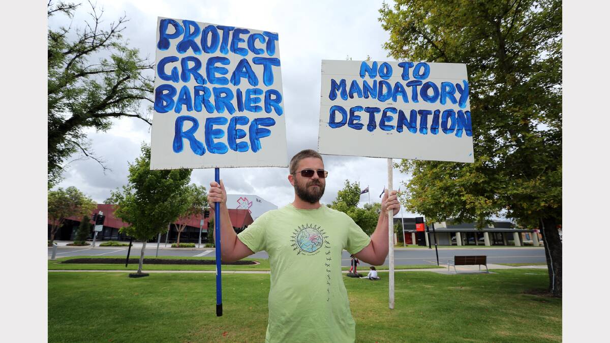 Lok Smith, of Wodonga, shows his support at the March in March protest objecting to the Abbott Government, held in Woodland Grove, Wodonga.