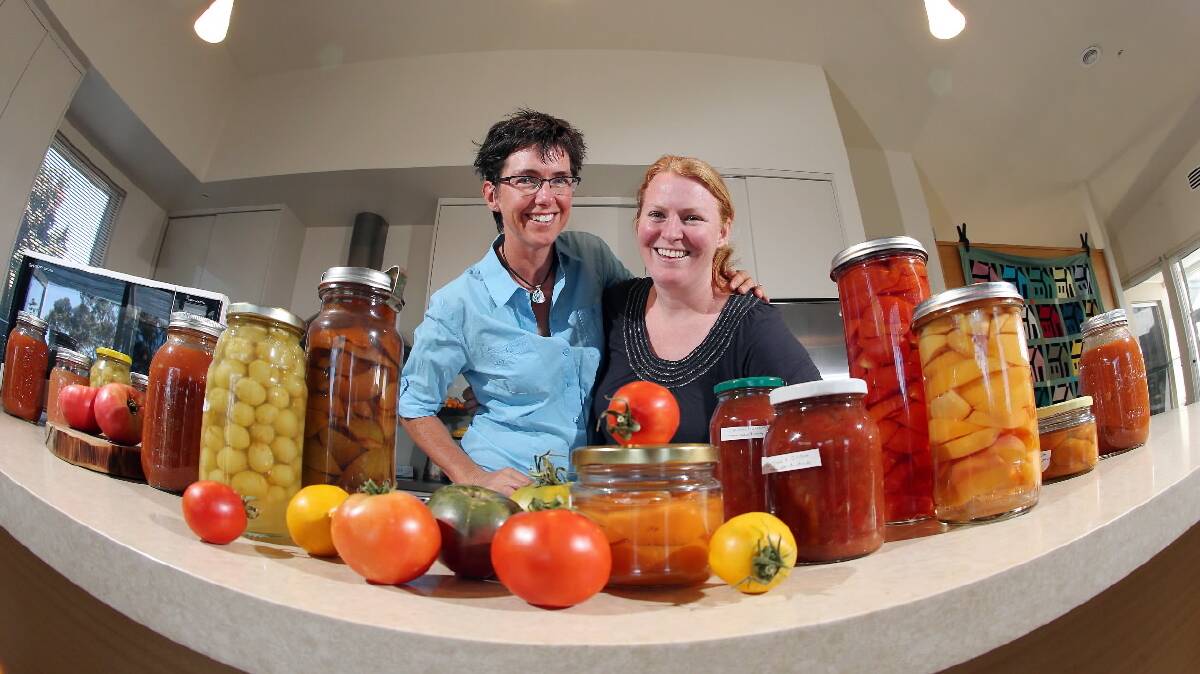 Anna Sullivan and Emma Street with a collection of fresh and bottled produce. Picture: JOHN RUSSELL