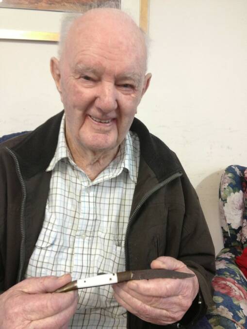 Retiree Pat Conrick with the knife he has donated to the Burke Museum at Beechworth.