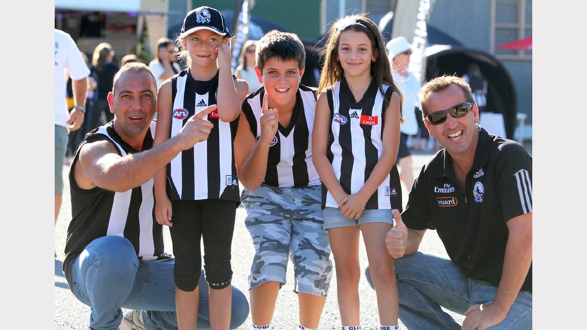 Dedicated Magpies followers Damian Monteleone and his daughter Zoe, 7, with siblings Jai, 10, and Sienna, 8, and their father Sam Pulvirenti, all of Shepparton, at the Norm Minns Oval, Wangaratta.