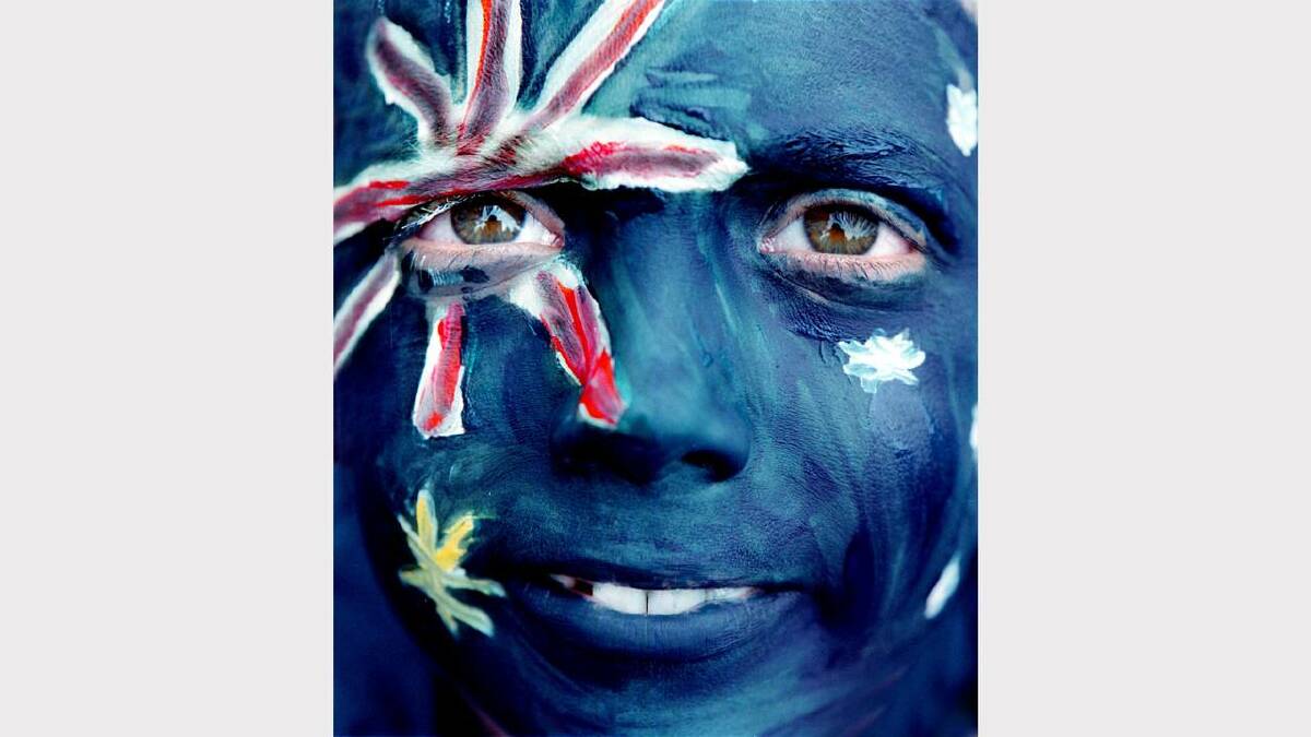Chris Whitehead, 9, of Wodonga, had his face painted as an Aussie flag at Willow Park on Australia Day. Picture: CHRIS McCORMACK